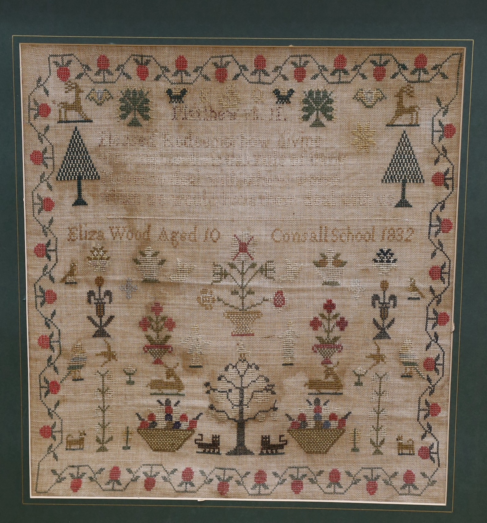 A late 19th century sample by Eliza Wood, aged 10, dated 1882, 43 x 40cm, together with a smaller glazed frame needlework panel of a lady leaning